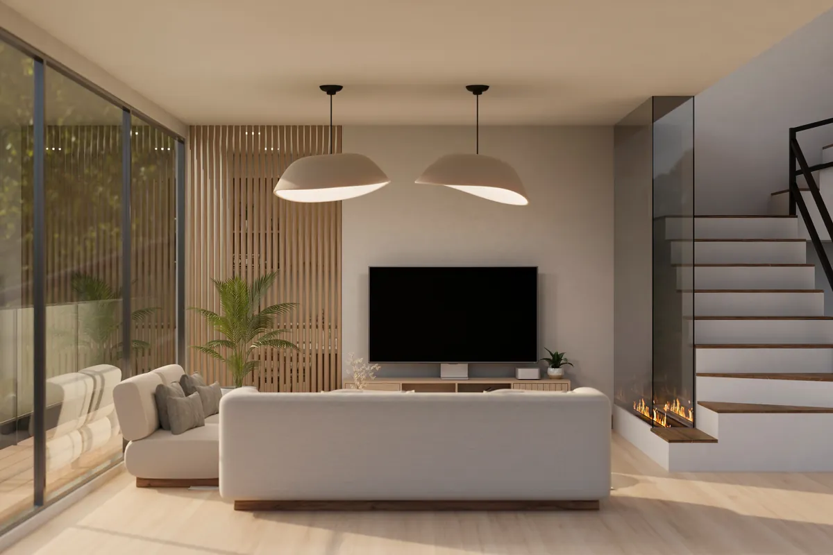 Salón con chimenea y la escalera de acceso al piso superior